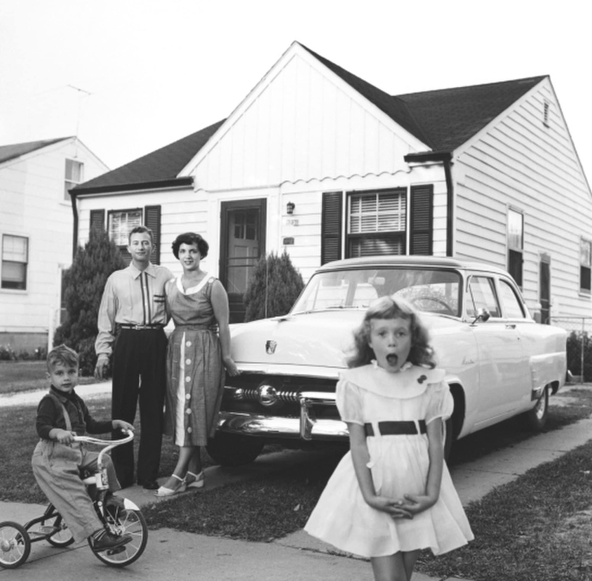 Family out front of their house in 1950